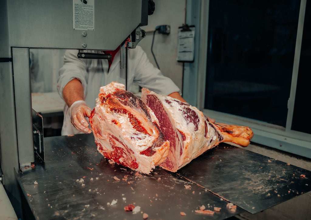 Processing beef leg at WP Meat Co in Enfield, Illinois. 